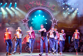 Dan Partridge as Danny, Paul French as Kenickie and Damon Gould as Sonny, with the company in GREASE  - Manuel Harlan