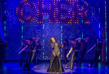 Debbie Kurup as Star (centre) in The Cher Show  - Pamela Raith
